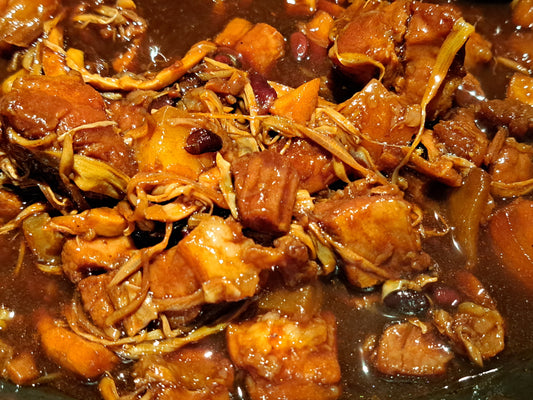 Close-up of pork humba simmered in a rich dark sauce