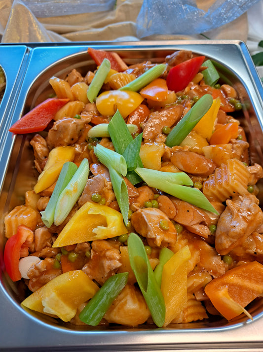 Chicken afritada with potatoes, carrots and colourful peppers in tomato sauce
