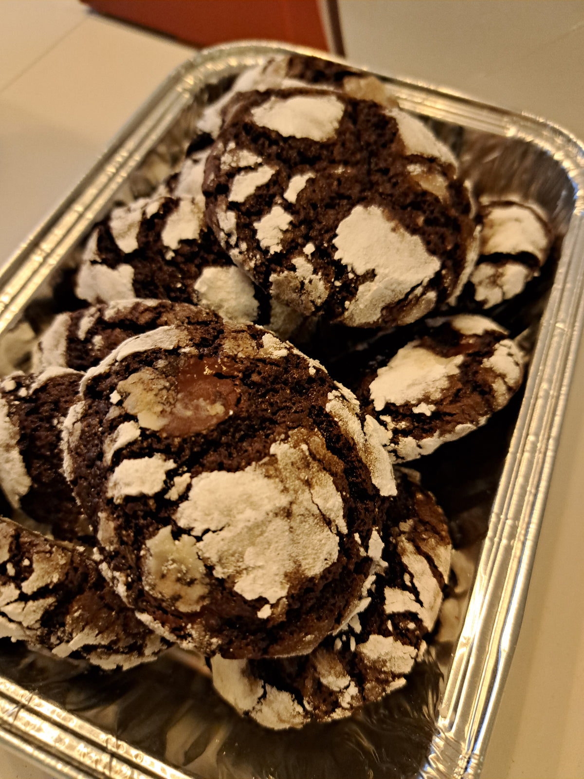 Close-up of stacked choco crinkles in a foil tray