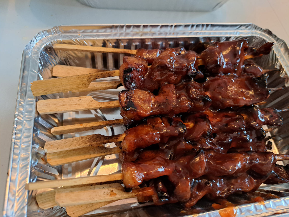 Filipino pork barbecue skewers with a sweet glossy glaze