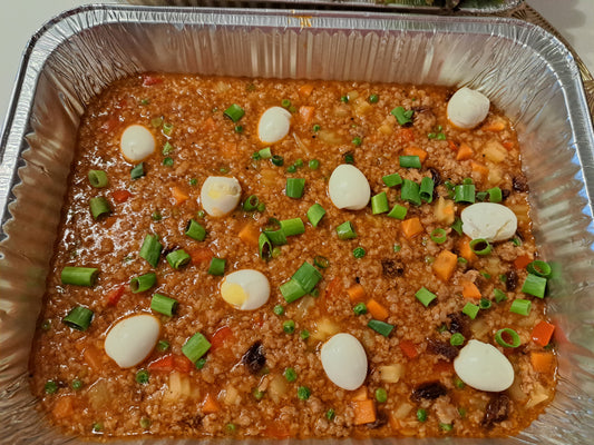Filipino pork giniling with potatoes, carrots, peas and boiled eggs in a catering tray