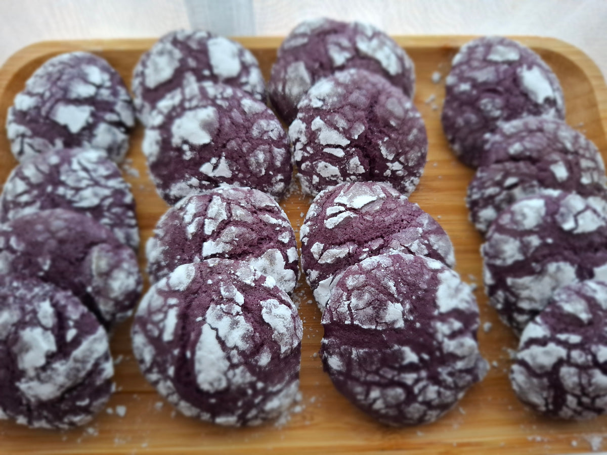 Ube crinkle cookies arranged together in a serving tray