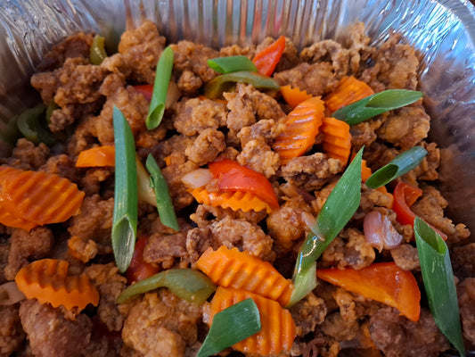 Filipino sweet and sour chicken with colourful vegetables