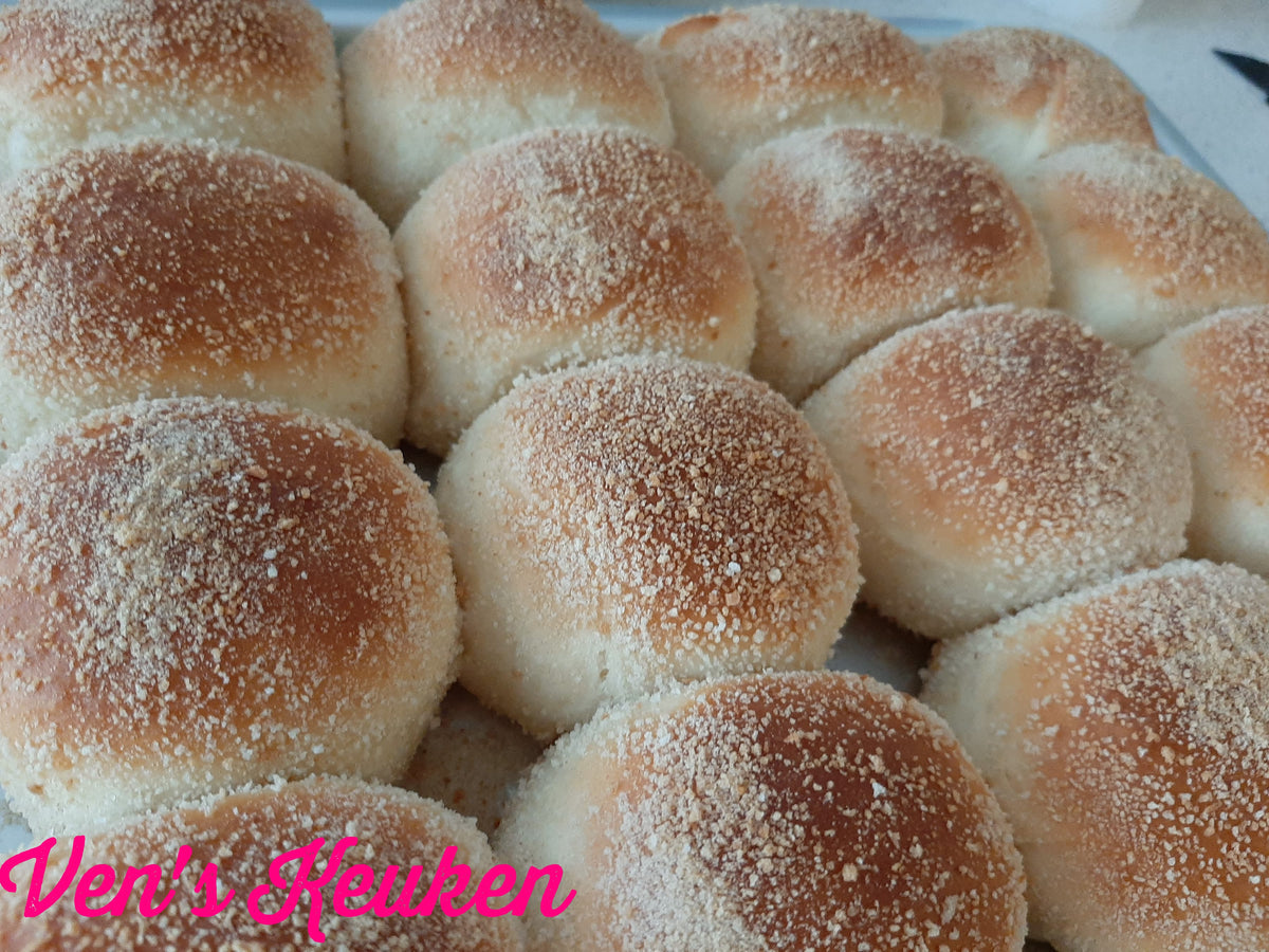 Freshly baked classic pandesal with evenly browned breadcrumb tops