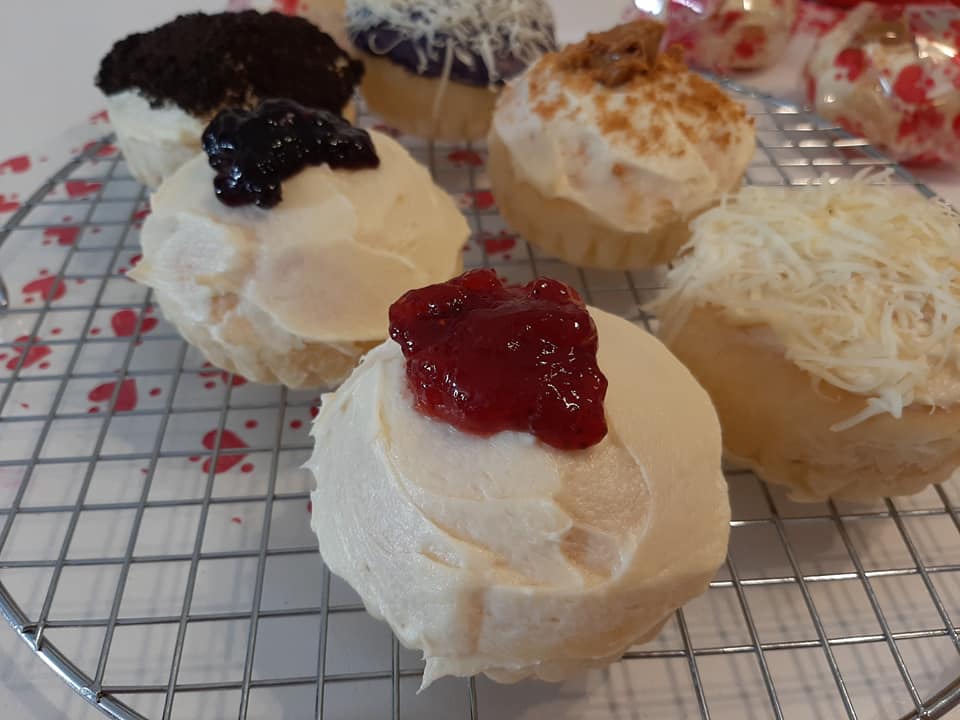 Close-up of special ensaymada with cheese, fruit and chocolate toppings