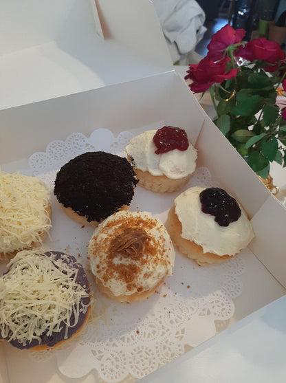 Assorted special ensaymada displayed in an open gift box
