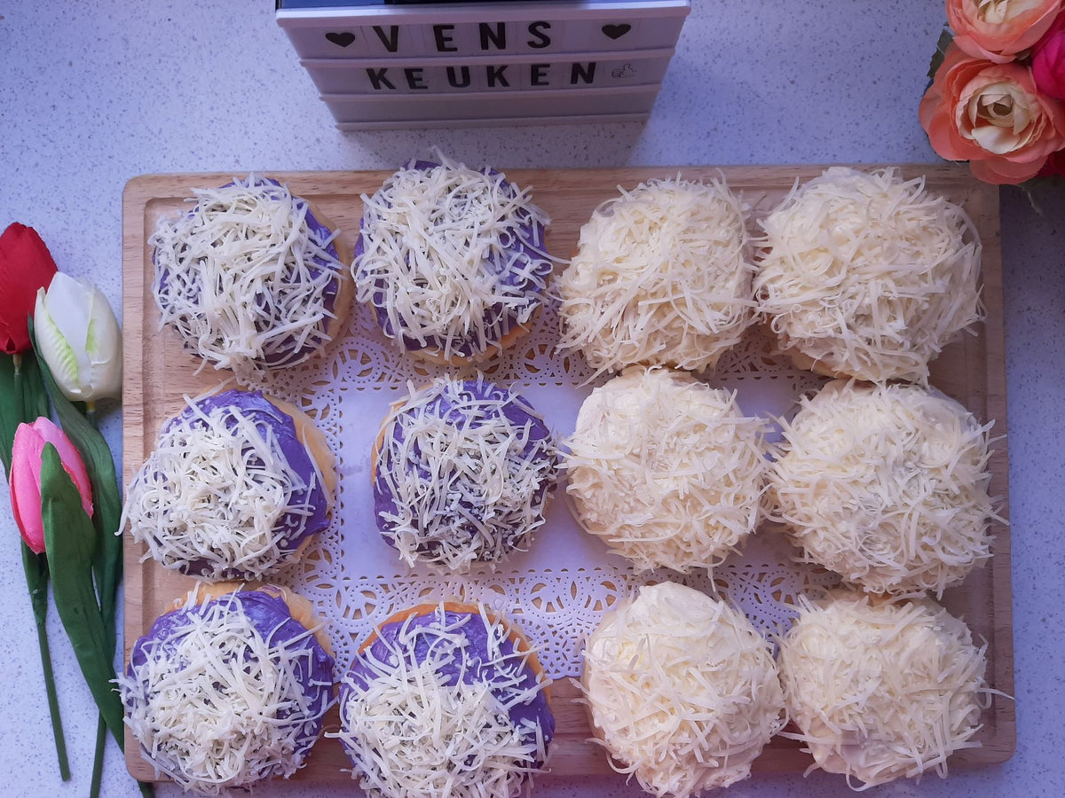 Twelve special ensaymada arranged in four flavours and topped with grated cheese