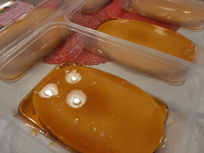 Close-up of smooth leche flan covered with golden caramel syrup