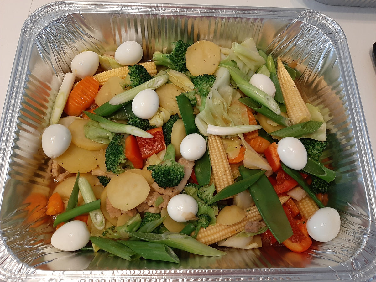 Top view of colourful Filipino Chop Suey in a large foil serving tray