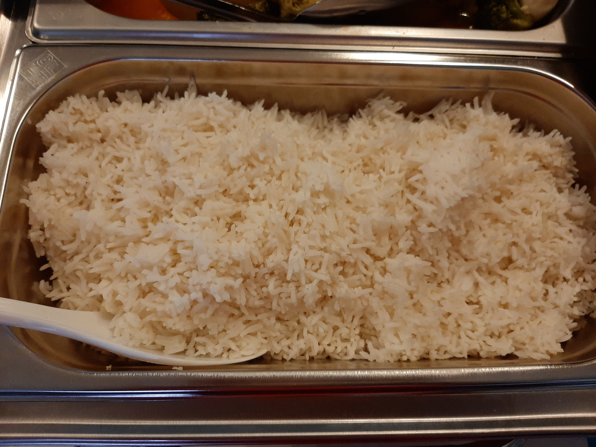 Catering pan of steamed white rice ready to serve