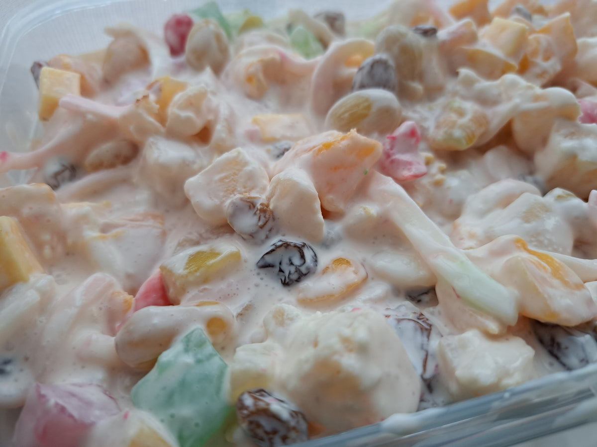 Close-up of Filipino fruit salad with raisins and coconut strips