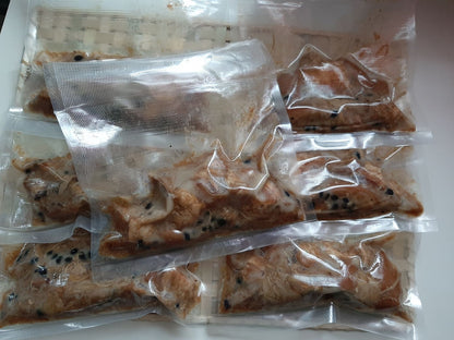 Individual frozen pork humba portions sealed in clear pouches