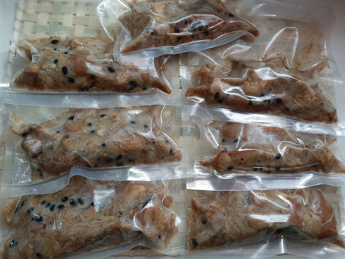 Rows of vacuum-packed pork humba 200 g portions