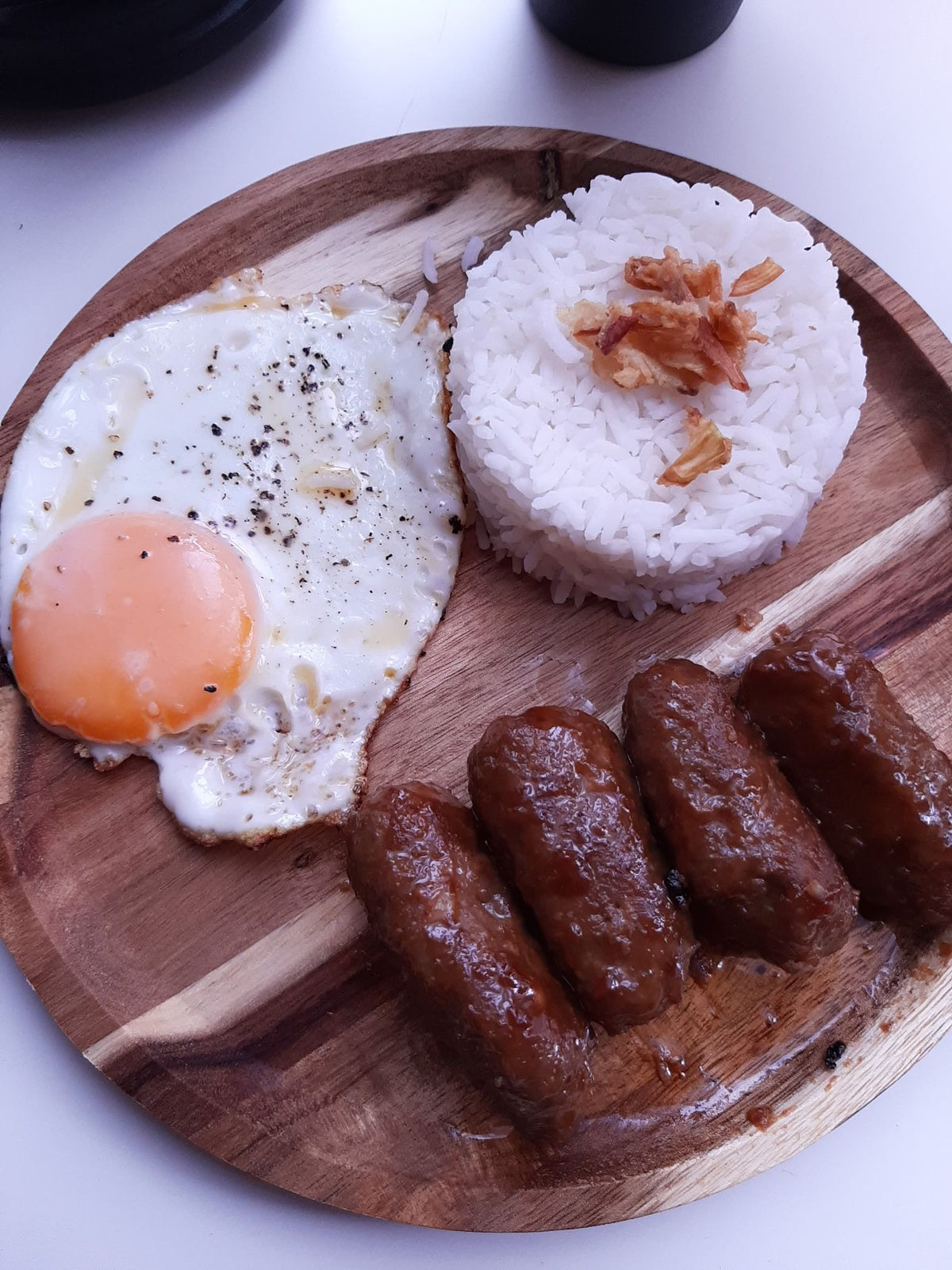 Chicken longganisa breakfast plate with fried egg and steamed rice