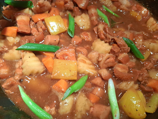 Filipino pork menudo with potatoes, carrots and bell pepper