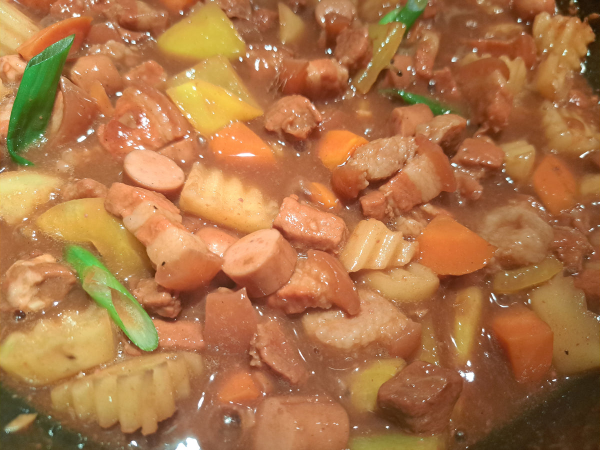 Pork menudo with sausage, pork and mixed vegetables in tomato sauce