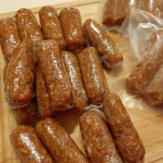 Skinless pork longganisa sausages displayed cooked and vacuum-packed