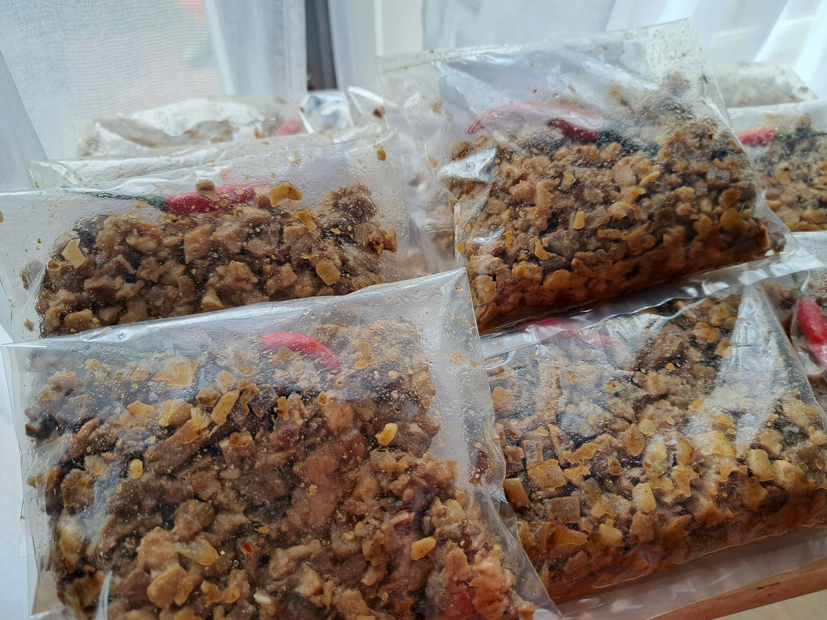 Rows of vacuum-packed pork sisig 200 g portions
