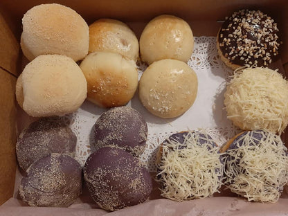 Bread box with pandesal, ube rolls, cheese-topped buns and ensaymada