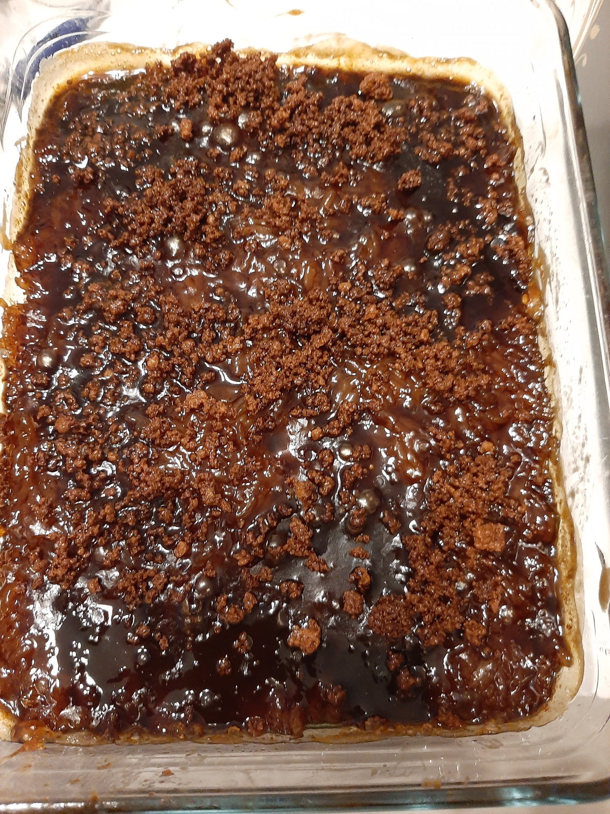 Close-up of glossy caramel coconut topping on biko bibingka malagkit