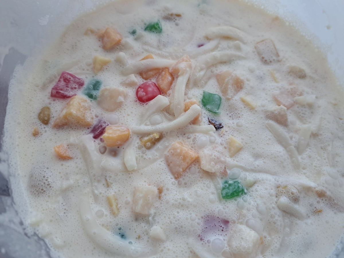 Top view of creamy Filipino fruit salad with colourful jelly pieces