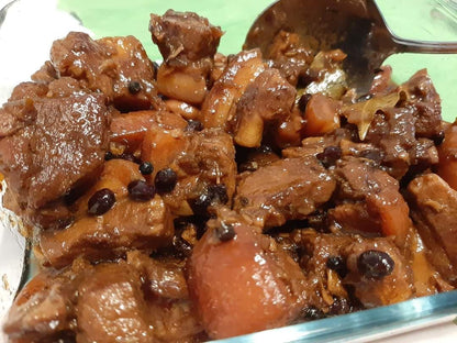 Cooked pork humba with tender meat, carrots and whole peppercorns