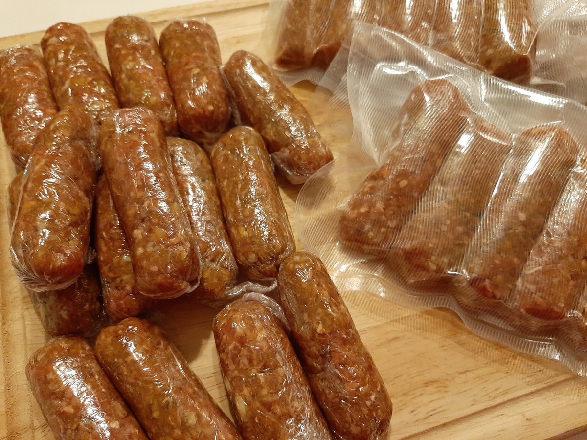 Skinless chicken longganisa sausages displayed cooked and vacuum-packed