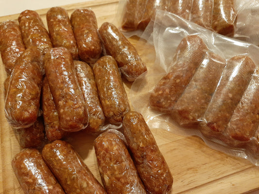 Skinless chicken longganisa sausages displayed cooked and vacuum-packed