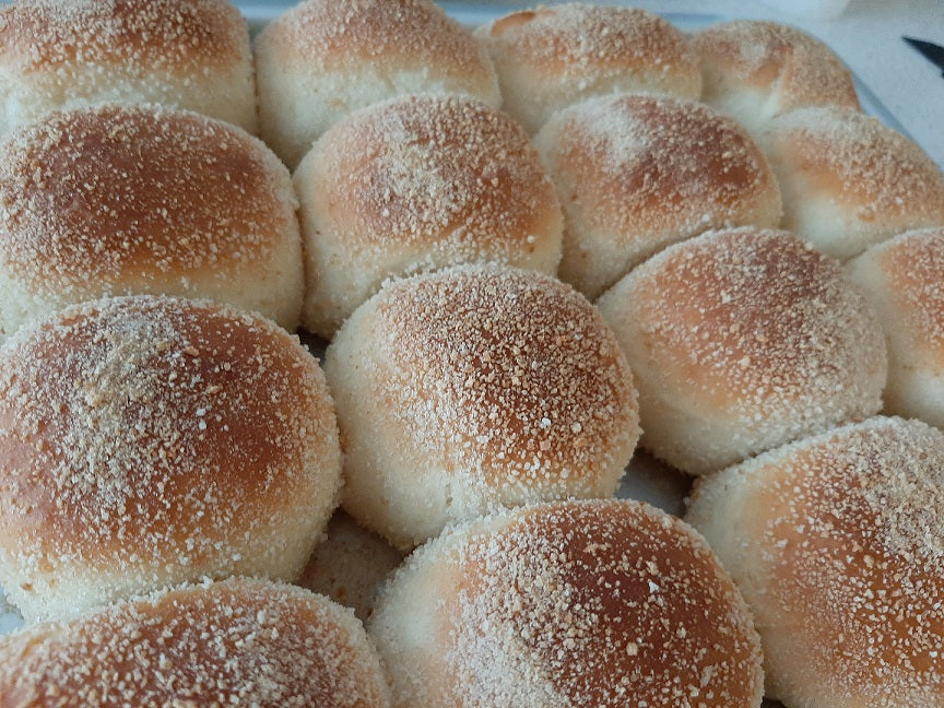 Large batch of classic Filipino pandesal fresh from the oven