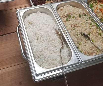 Buffet pans showing plain white rice beside garlic rice
