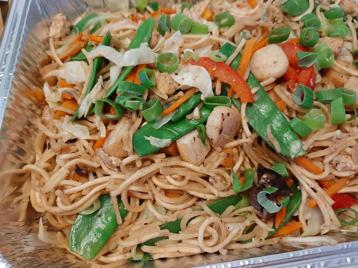 Close-up of pancit Canton noodles with colourful vegetables and spring onions